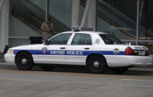 police car pulling over people who are texting and driving